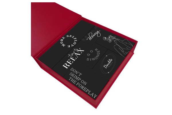Open branded gift box with individual adult product compartments