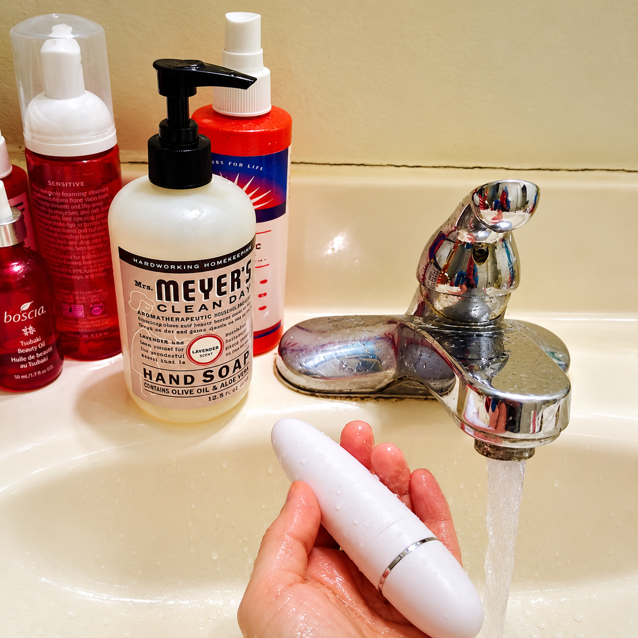Adult toy cleaned near soap and running water