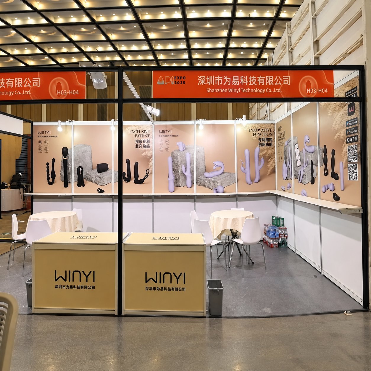 WINYI booth at Shanghai APIEXPO 2025 with H03-H04 banner, orange booth header, products displayed on shelves, two black WINYI display cubes in front