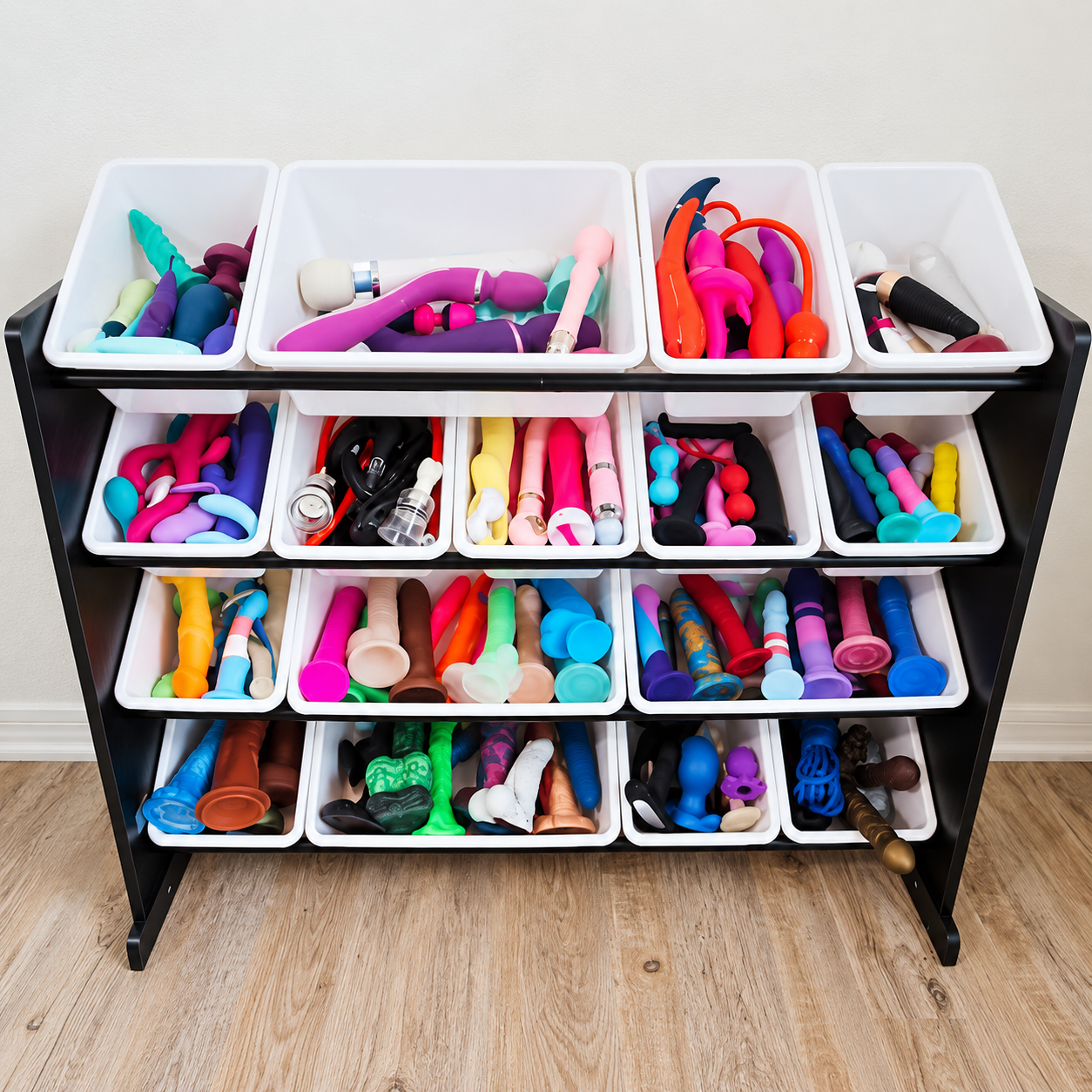 Adult toys separated in drawer organizers by type and material